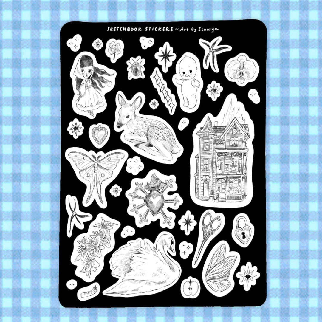Sheet of black and white stickers on a blue checkered background
