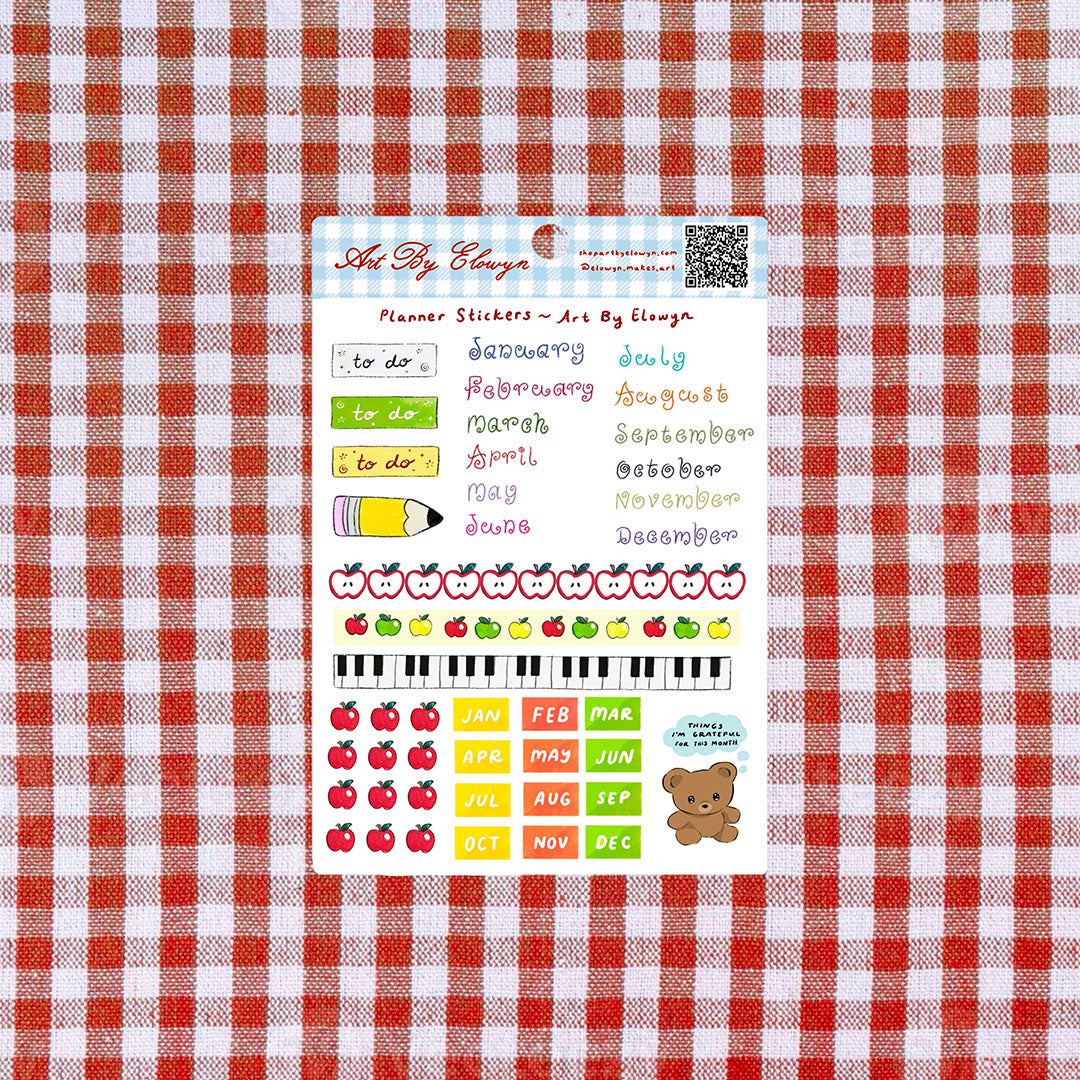 Sticker sheet of planner stickers on a red and white checkered background