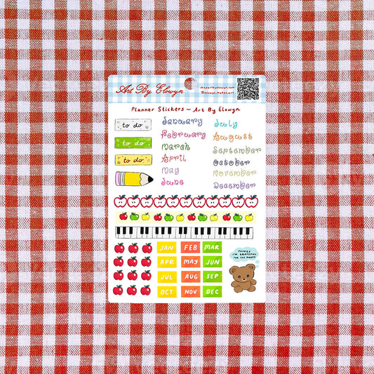 Sticker sheet of planner stickers on a red and white checkered background