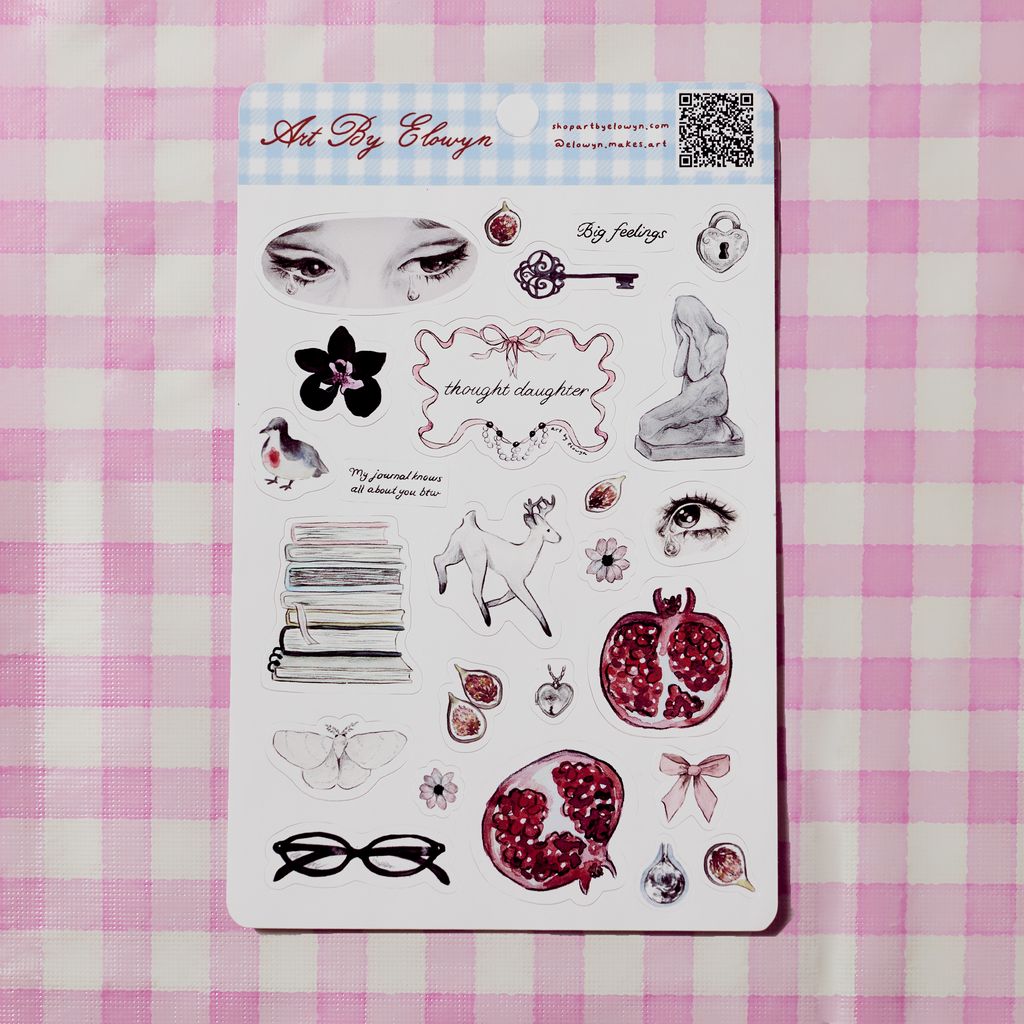 Sheet of stickers with artistic designs on a pink and white checkered background