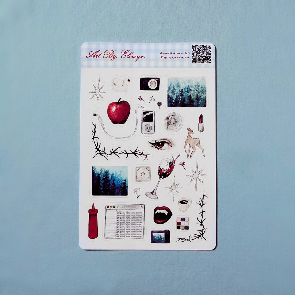 Sheet of decorative stickers with various designs on a light blue background